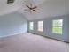 Large bedroom with vaulted ceiling, ceiling fan, neutral carpet, and ample natural light at 1892 Old Dogwood, Jonesboro, GA 30238