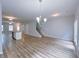 Open-concept living area with a view of the staircase, kitchen, and backyard access at 1892 Old Dogwood, Jonesboro, GA 30238