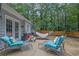 Relaxing backyard patio with comfortable seating and a hammock for outdoor enjoyment at 4180 Gables Pl, Buford, GA 30519