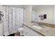 Cozy bathroom with a granite countertop, neutral colors, and tiled floors at 4180 Gables Pl, Buford, GA 30519