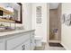 Beautiful bathroom with granite counters, double sinks, and a tiled shower with a bench at 4180 Gables Pl, Buford, GA 30519