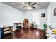 Empty bedroom with toys, hardwood floors, a ceiling fan and lots of light at 4180 Gables Pl, Buford, GA 30519