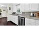 Kitchen area with granite countertops, wood flooring, stainless steel appliances, and ample lighting at 4180 Gables Pl, Buford, GA 30519