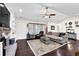The living room showcases vaulted ceilings, a fireplace, built-in shelving, and abundant natural light at 4180 Gables Pl, Buford, GA 30519