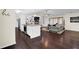 Open concept floor plan with a kitchen island flowing to a living room at 4180 Gables Pl, Buford, GA 30519