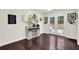 Inviting dining area featuring wood floors, bright walls, decor, and access to the backyard at 4180 Gables Pl, Buford, GA 30519