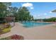 A refreshing outdoor community pool with lounge chairs and lush landscaping creates a resort-like atmosphere at 4180 Gables Pl, Buford, GA 30519