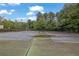 Outdoor tennis courts with surrounding landscaping offer residents recreational opportunities at 4180 Gables Pl, Buford, GA 30519