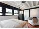 Bright bedroom with large windows, modern storage, and a comfortable lounge area at 878 Peachtree Ne St # 704, Atlanta, GA 30309
