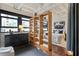 Bright bedroom with large windows, hardwood floors, and stylish divider with shelving at 878 Peachtree Ne St # 704, Atlanta, GA 30309