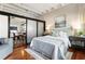 Inviting bedroom with a cozy bed, modern furniture, and a view into the adjacent living space at 878 Peachtree Ne St # 704, Atlanta, GA 30309
