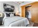 Stylish bedroom showcasing a cozy bed, accent pillows, and convenient closet access at 878 Peachtree Ne St # 704, Atlanta, GA 30309