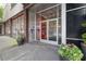 Modern building entrance with glass doors, planters, and a well-maintained exterior creating a professional impression at 878 Peachtree Ne St # 704, Atlanta, GA 30309