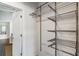 Well-organized closet featuring adjustable metal shelving for efficient storage solutions at 878 Peachtree Ne St # 704, Atlanta, GA 30309