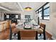 Cozy dining area connected to the living room, featuring modern decor, hardwood floors, and bright, natural lighting at 878 Peachtree Ne St # 704, Atlanta, GA 30309