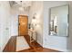 Charming entryway with stylish lighting, hardwood floors, and a decorative table creating a welcoming atmosphere at 878 Peachtree Ne St # 704, Atlanta, GA 30309