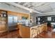 Modern kitchen features stainless steel appliances, a large island with barstool seating, and direct sightlines to the living area at 878 Peachtree Ne St # 704, Atlanta, GA 30309