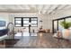 Open-concept kitchen with granite countertops, modern faucet, and view into the living and dining area at 878 Peachtree Ne St # 704, Atlanta, GA 30309