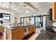 Spacious kitchen with stainless steel appliances, granite countertops, and an island with seating; open to the living area at 878 Peachtree Ne St # 704, Atlanta, GA 30309