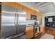 Modern kitchen features stainless steel appliances, light wood cabinetry, and granite countertops at 878 Peachtree Ne St # 704, Atlanta, GA 30309
