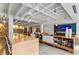 Open living space with modern table, bookshelves and TV viewing area at 878 Peachtree Ne St # 704, Atlanta, GA 30309