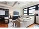 Comfortable living room featuring a sofa, modern decor, and a large window offering natural light and city views at 878 Peachtree Ne St # 704, Atlanta, GA 30309