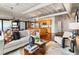 Cozy living room featuring a comfortable sofa, stylish decor, and an open layout connecting to the kitchen at 878 Peachtree Ne St # 704, Atlanta, GA 30309