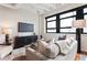 Bright living room with a large window, modern furnishings, and a comfortable sofa for relaxation and entertainment at 878 Peachtree Ne St # 704, Atlanta, GA 30309