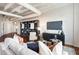 Spacious living room with modern furniture, a built-in bookcase, and an open layout for comfortable living and entertaining at 878 Peachtree Ne St # 704, Atlanta, GA 30309