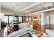 Living room with an open layout connecting to a modern kitchen and dining space at 878 Peachtree Ne St # 704, Atlanta, GA 30309