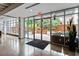 Inviting lobby area with sleek concrete floors, large windows, and access to an outdoor patio at 878 Peachtree Ne St # 704, Atlanta, GA 30309