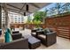 Relaxing outdoor patio with comfortable seating, a covered awning, and lush landscaping at 878 Peachtree Ne St # 704, Atlanta, GA 30309