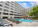 Spacious pool deck features ample lounge seating, a spa and easy building access at 878 Peachtree Ne St # 704, Atlanta, GA 30309