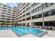 Inviting community pool area with lounge seating and convenient building access at 878 Peachtree Ne St # 704, Atlanta, GA 30309