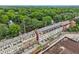 Aerial view of elegant townhomes with a community feel, nestled amidst lush greenery and mature trees at 190 Marion Ne Pl, Atlanta, GA 30307