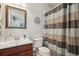 Cozy bathroom featuring a single sink, decorative shower curtain and painted sand dollar art at 190 Marion Ne Pl, Atlanta, GA 30307