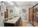 Bathroom boasts a double sink vanity with granite countertops and a glass enclosed shower at 190 Marion Ne Pl, Atlanta, GA 30307