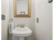 Cozy half-bathroom with pedestal sink, modern faucet and fixtures at 190 Marion Ne Pl, Atlanta, GA 30307