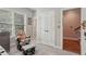 Bedroom featuring a gray rocking chair, double door closet, and hallway access at 190 Marion Ne Pl, Atlanta, GA 30307