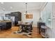 Dining room featuring dark wood table, chair set, hardwood floors and decorative lighting at 190 Marion Ne Pl, Atlanta, GA 30307