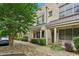 Exterior view of townhouses with covered porches, sidewalk, landscaping, and well-kept bushes at 190 Marion Ne Pl, Atlanta, GA 30307