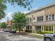 Charming townhome with a brick facade, manicured landscaping and covered entryway at 190 Marion Ne Pl, Atlanta, GA 30307