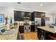 Modern kitchen features stainless steel appliances, granite countertops, and dark cabinets at 190 Marion Ne Pl, Atlanta, GA 30307