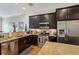 Modern kitchen features stainless steel appliances, granite countertops, and dark cabinets at 190 Marion Ne Pl, Atlanta, GA 30307