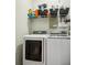 Laundry room with a front-load washer and dryer set and wire shelving at 190 Marion Ne Pl, Atlanta, GA 30307