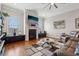 Elegant living room featuring a fireplace, hardwood floors, and natural light from large windows at 190 Marion Ne Pl, Atlanta, GA 30307