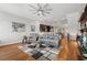 Spacious open-concept living room boasts hardwood floors, modern decor, and abundant seating at 190 Marion Ne Pl, Atlanta, GA 30307