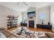 Bright living room with a fireplace, tv, floating shelves and stylish furniture at 190 Marion Ne Pl, Atlanta, GA 30307
