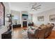 Inviting living room with hardwood floors, fireplace, ceiling fan, and comfortable leather seating at 190 Marion Ne Pl, Atlanta, GA 30307