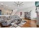 Bright, open living room featuring hardwood floors, a stylish ceiling fan, and neutral-toned decor at 190 Marion Ne Pl, Atlanta, GA 30307